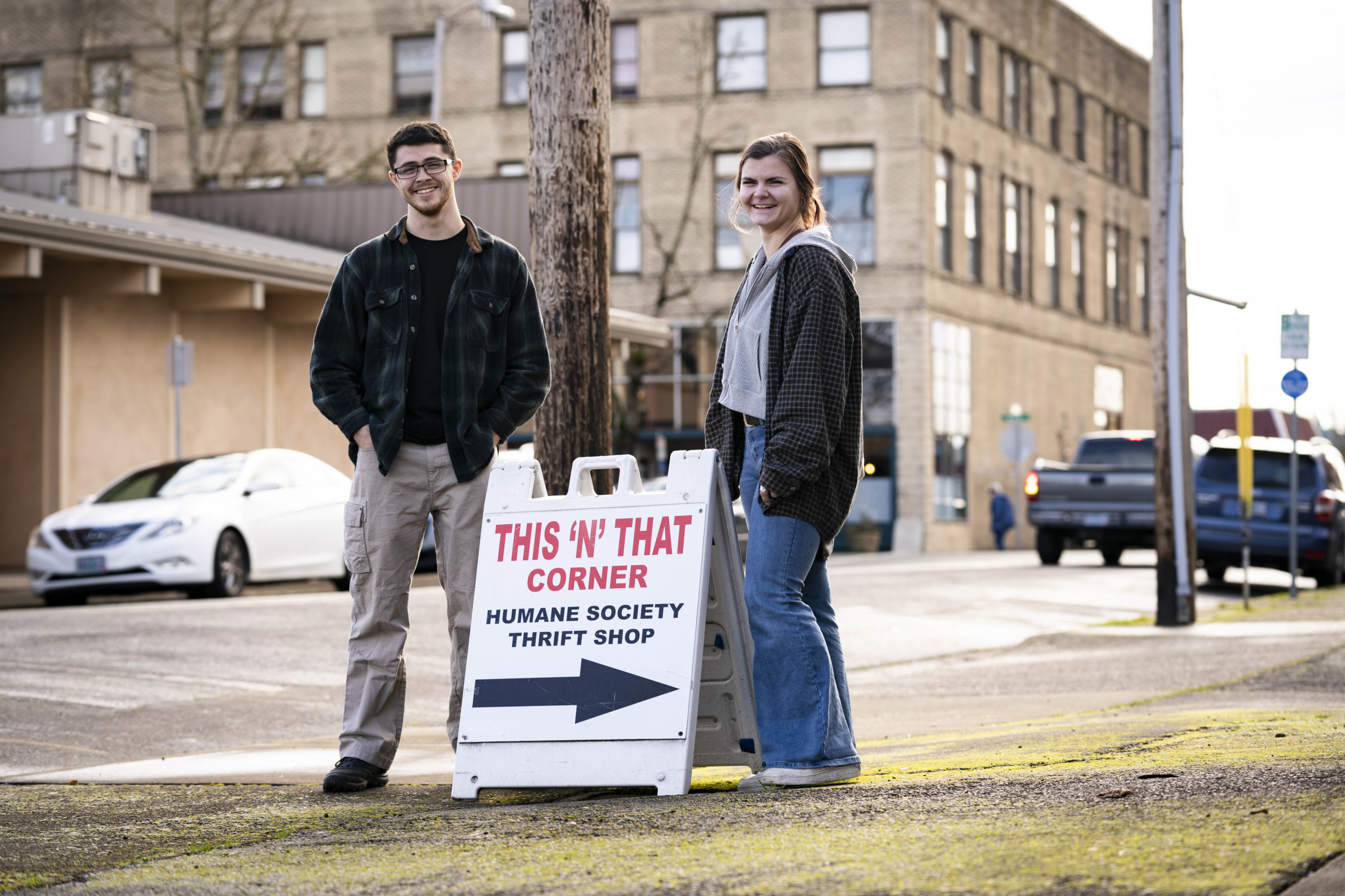 students standing in front of business sign