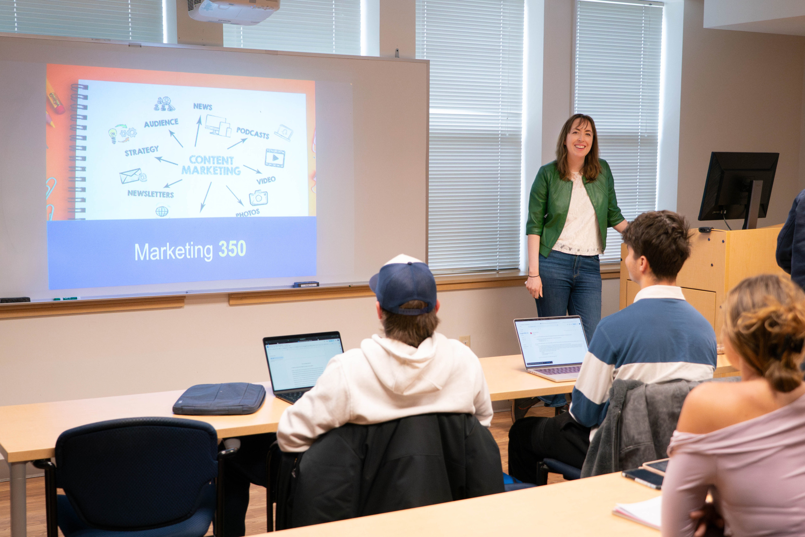 Marketing professor teaching undergraduate students during a classroom lecture