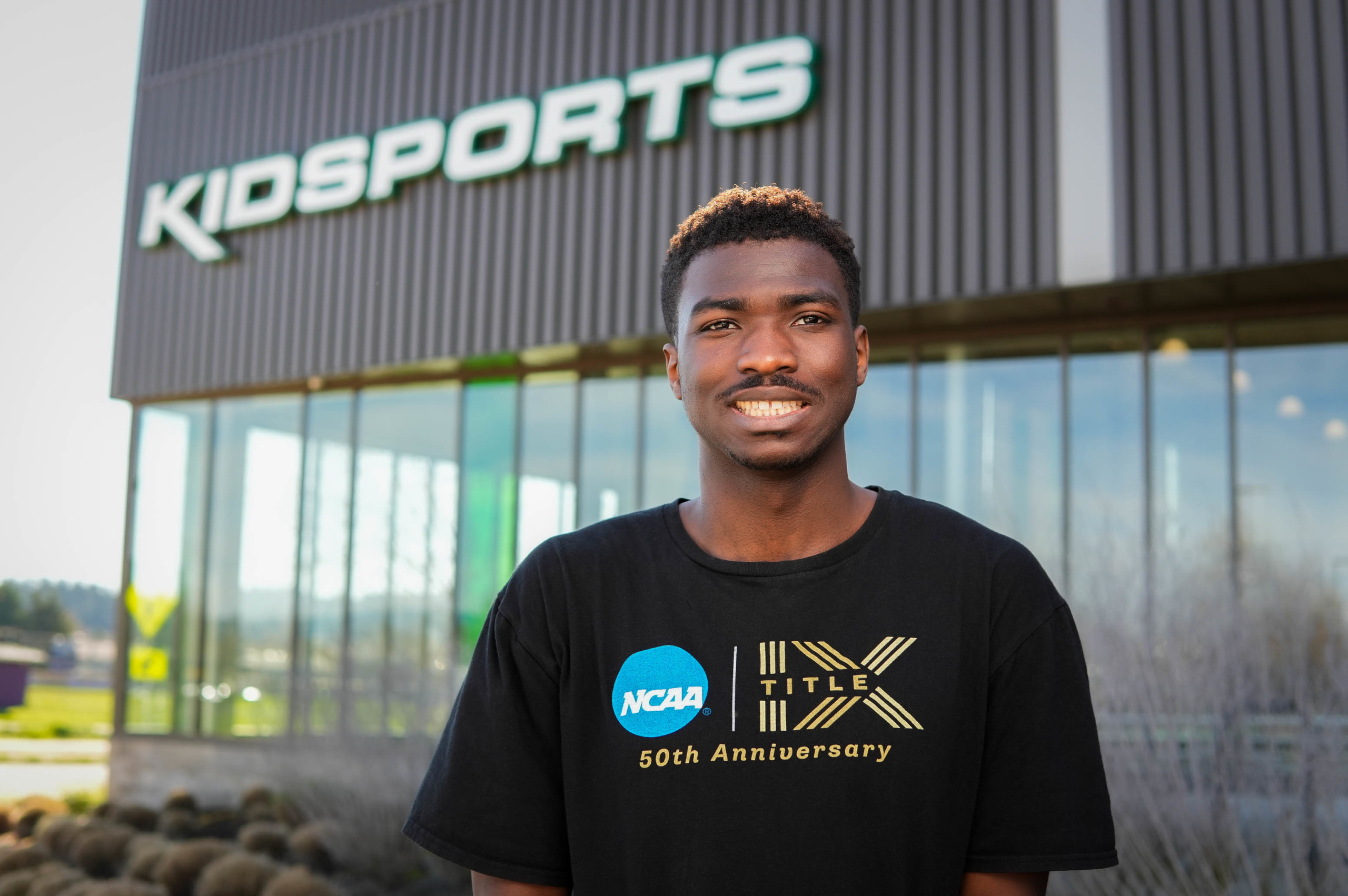 Portrait of college student in front of Kidsports community sports complex
