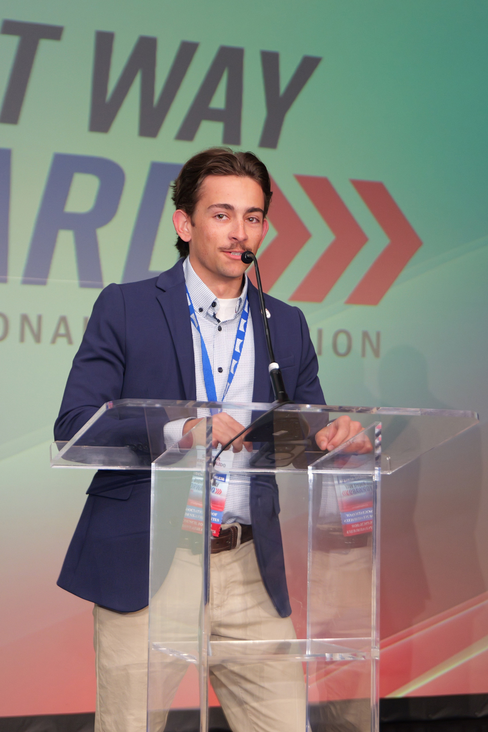 Student-athlete speaks at an NAIA conference event.